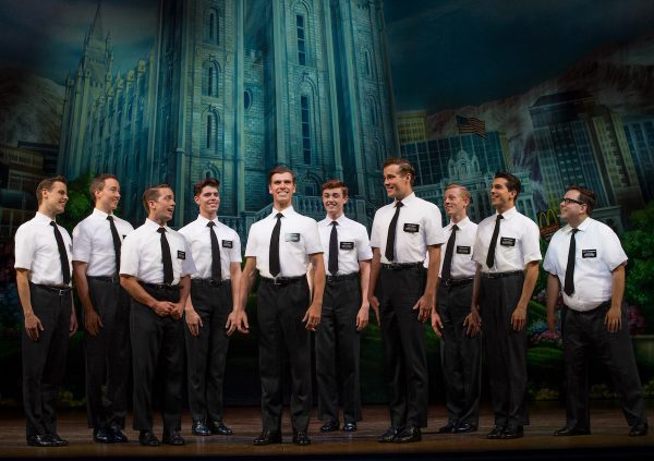 Blake Bowden, Nyk Bielak and ensemble in THE BOOK OF MORMON. Image Jeff Busby